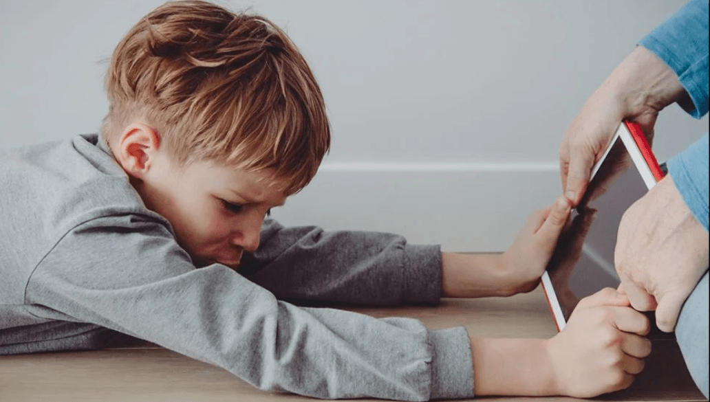 A child engaged in imaginative play inspired by screen content