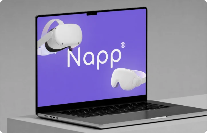 A laptop showing the Napp wordmark beside the VR headset and sleep mask